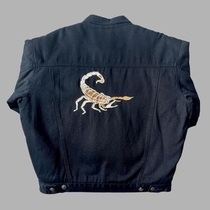black bomber jacket with an embroidered scorpion design